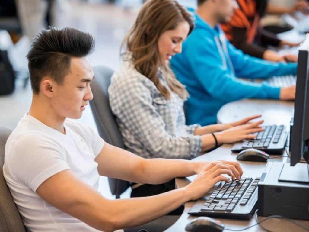 A group of people working on computers